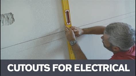 cutting out electrical box holes in wood paneling|wall paneling around switches.